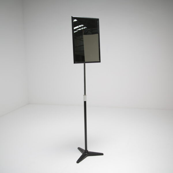 a vintage opticians floor mirror