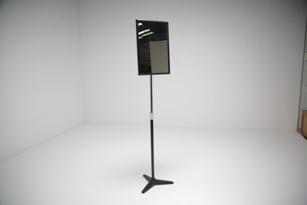 a vintage opticians floor mirror