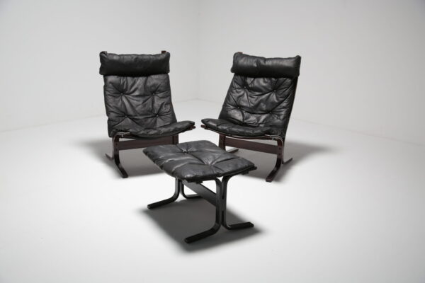 pair of black leather lounge chairs "siesta" by ingmar relling for westnofa, sweden, 1960s.