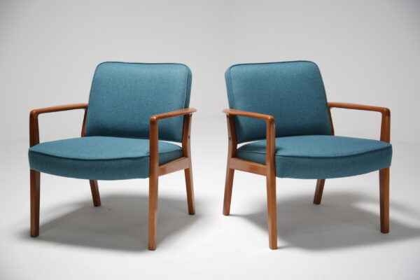 A pair of vintage teak lounge chairs.
