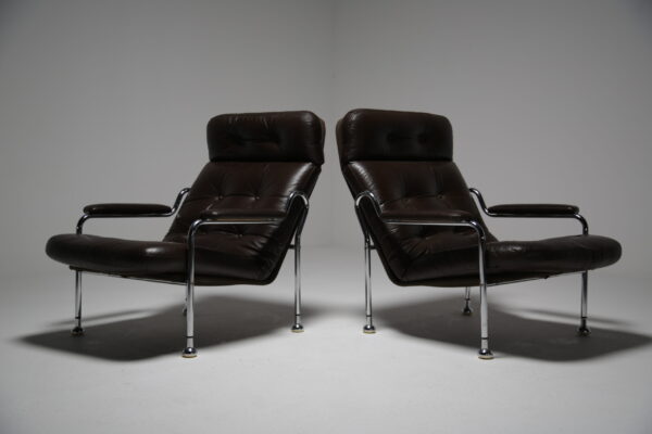 A pair of vintage Swedish brown leather and chrome armchairs