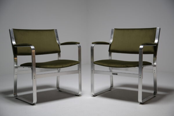 A Pair Of Olive Green Karl Erik Ekselius office chairs.