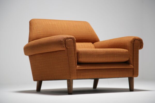 Orange tweed covered vintage armchair.