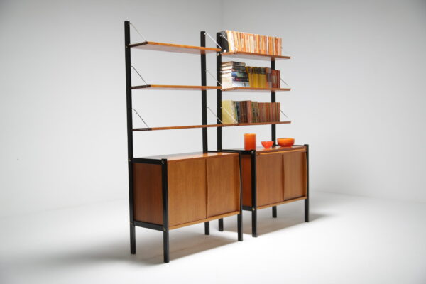 A Pair of teak bookcases with ebonised sides.