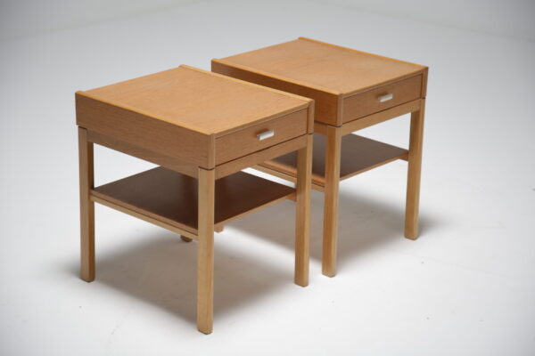 Oak bedside tables with chrome handle.
