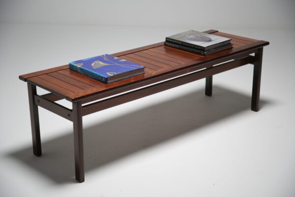 A slatted rosewood coffee table.